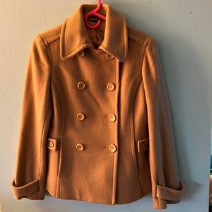 Express design studio. Camel colored jacket.